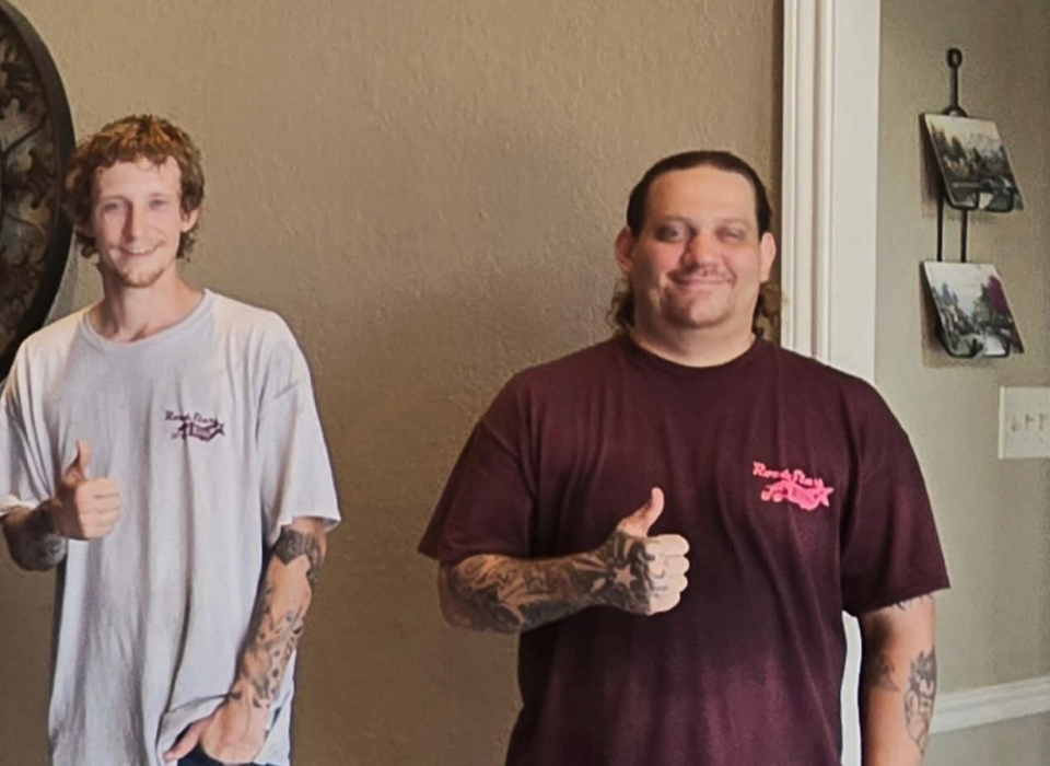 two thumbs up from team members